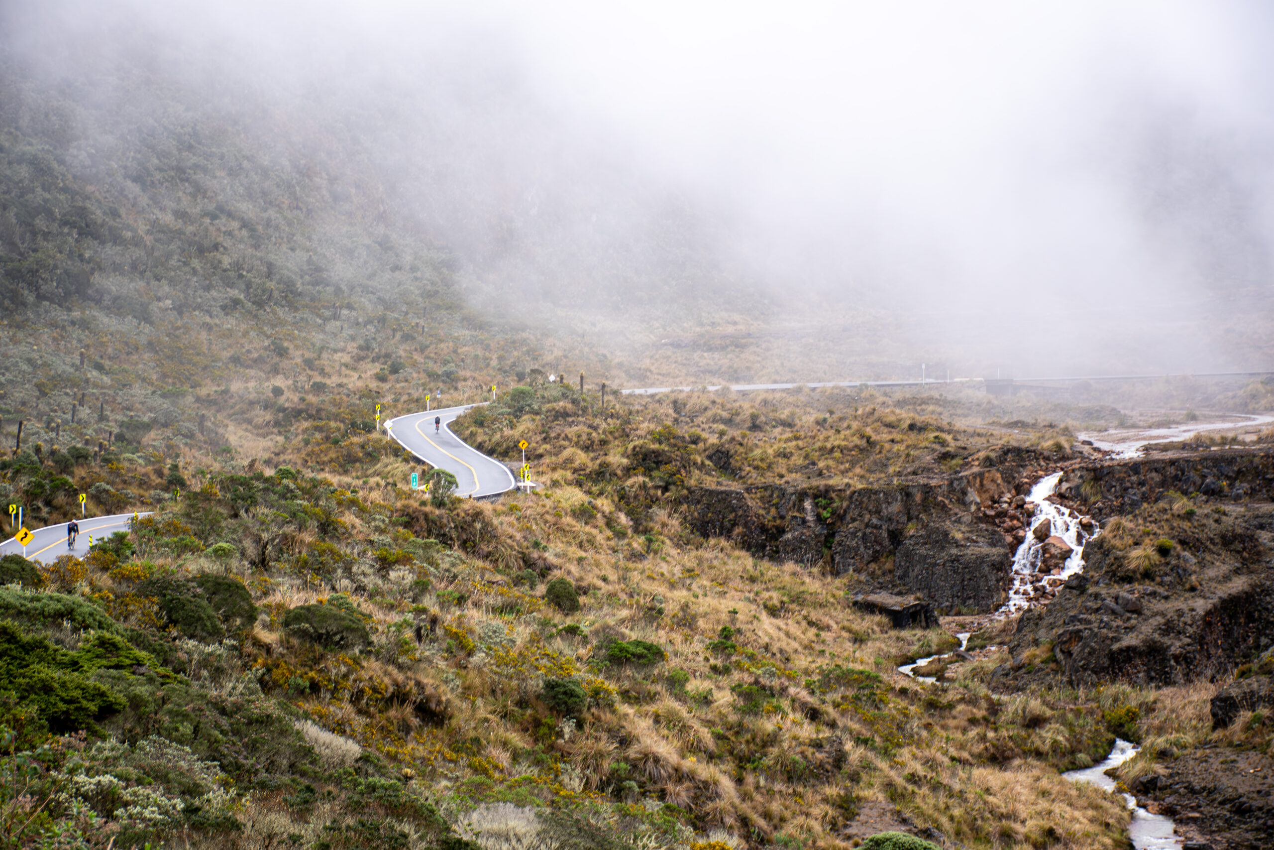 As a cyclist climbing Alto de Letras, you will experience a dramatic landscape shift from tropical heat to the breathtaking views of the high-altitude páramo at 3,700 meters.